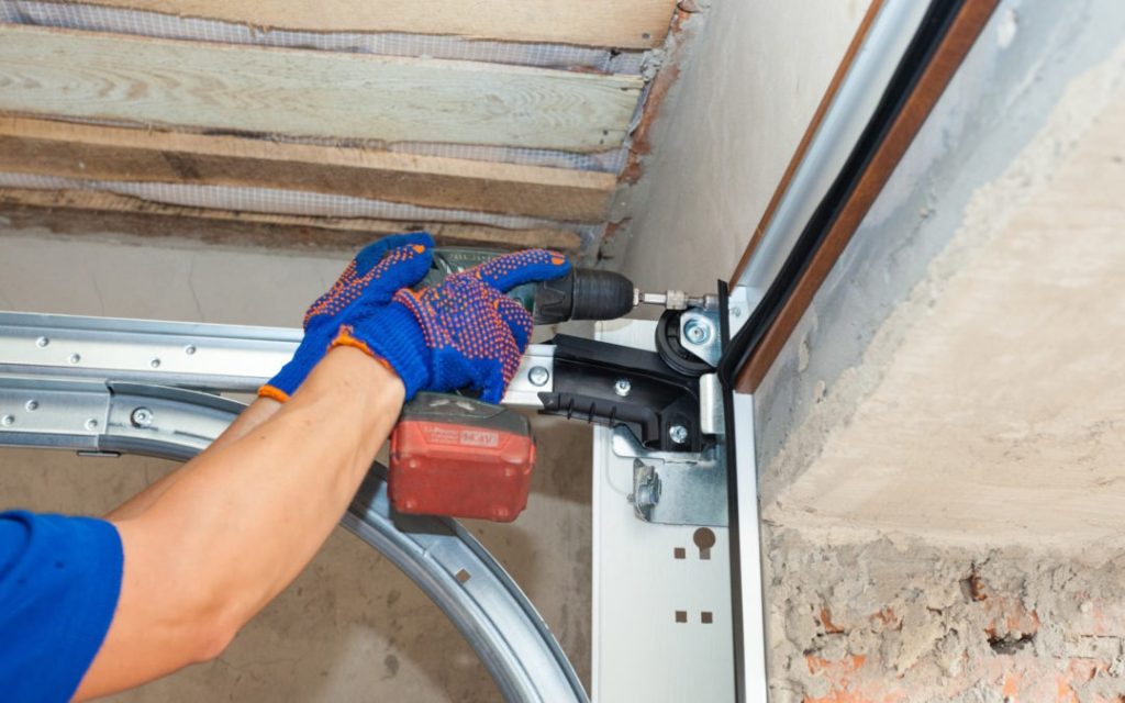 Tech repairing a garage door in Doylestown PA