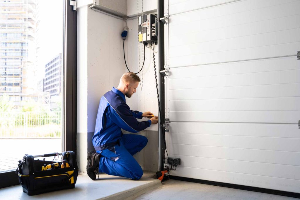 Technician Working on Garage Door