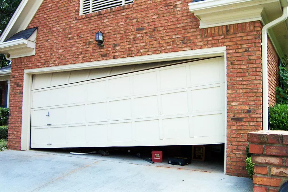 A garage door that's uneven, making it difficult to open or close