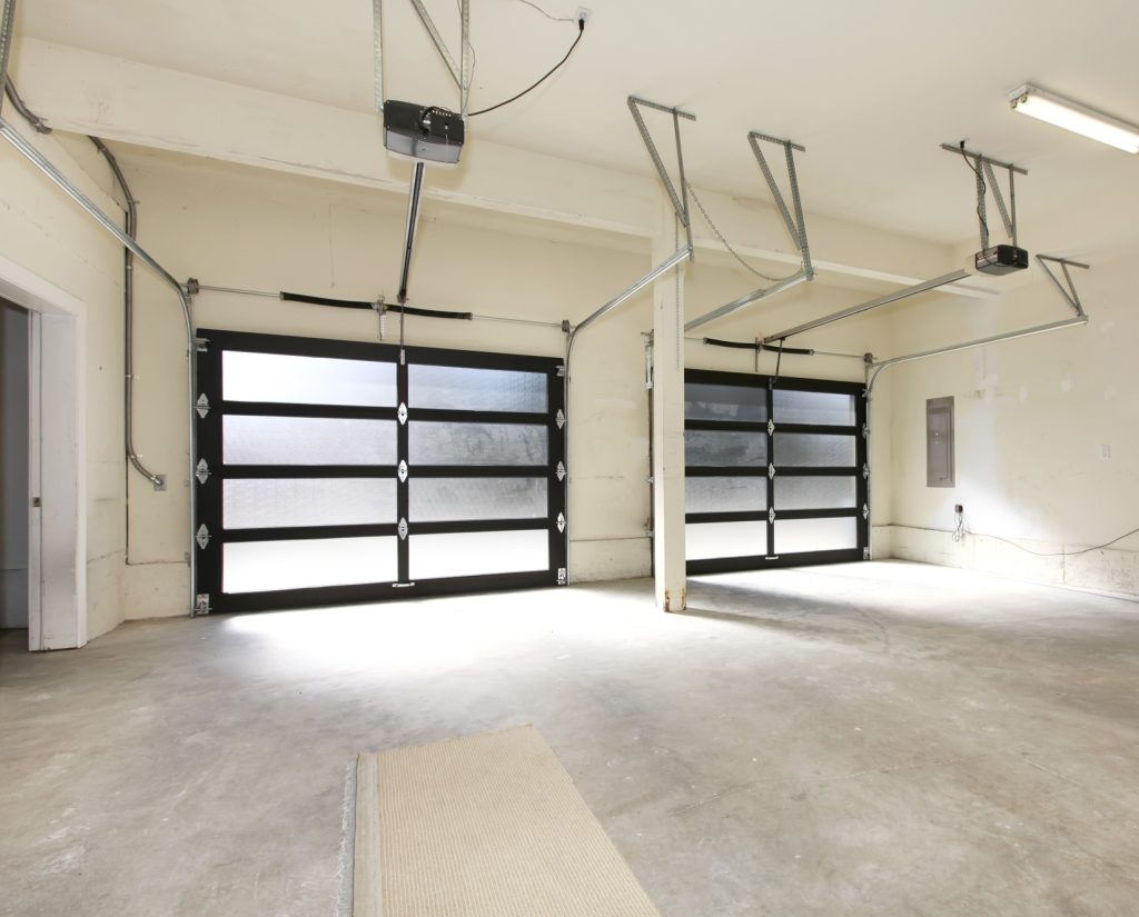 Modern two cars garagesv with glass doors.