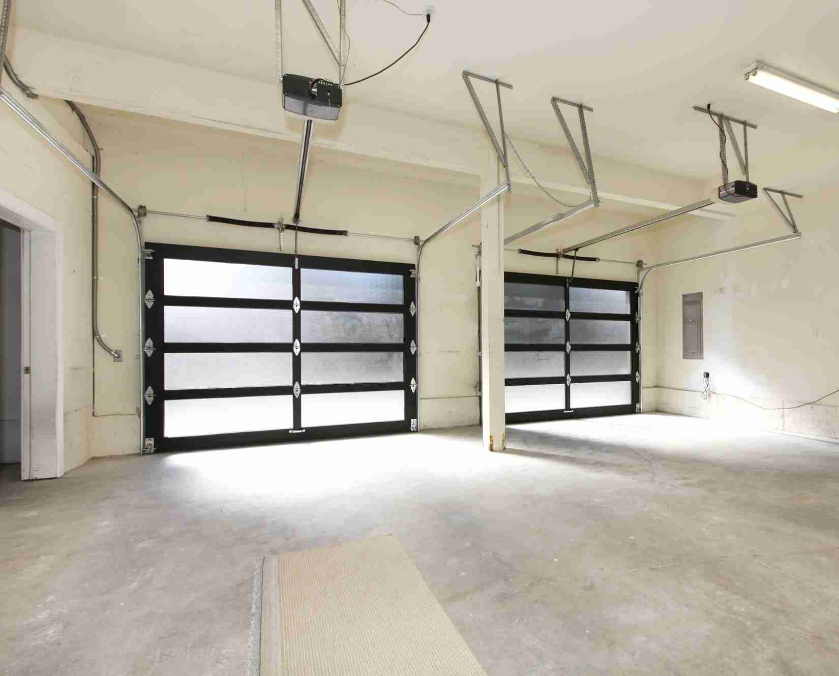 Modern two cars garagesv with glass doors.